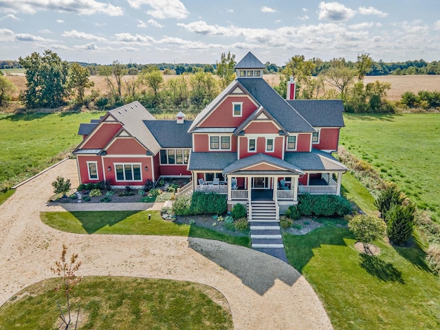 view of front facade with a front lawn and a porch