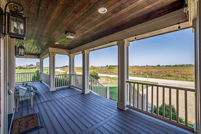 wooden terrace with a rural view