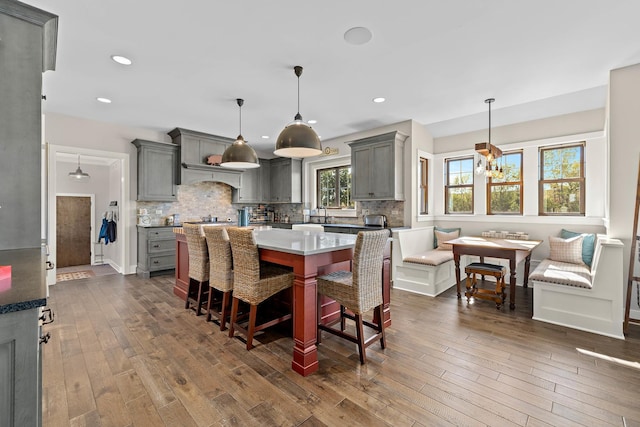 dining area with dark hardwood / wood-style flooring, an inviting chandelier, and breakfast area