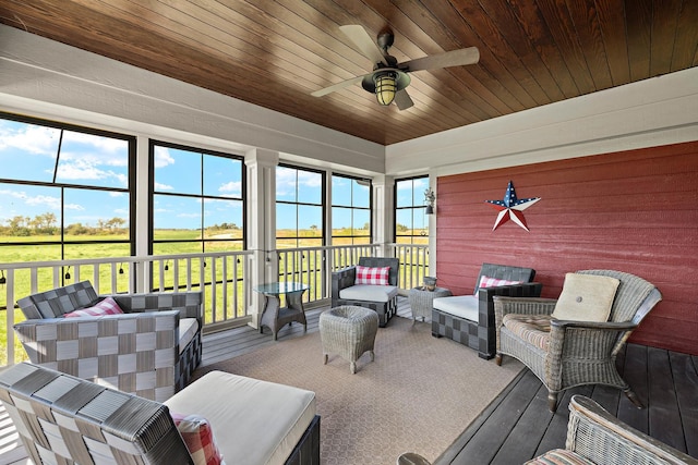 sunroom with wooden ceiling and ceiling fan