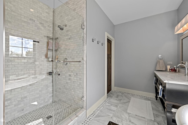 bathroom featuring vanity and a shower with shower door