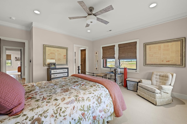 bedroom with ornamental molding, carpet flooring, and ceiling fan