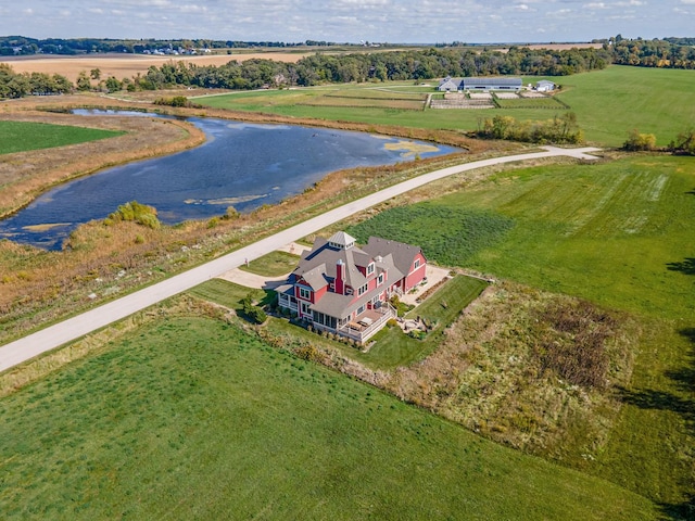 drone / aerial view with a water view and a rural view