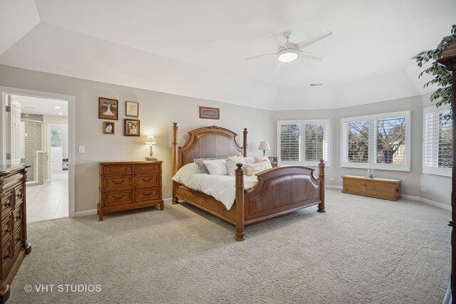 bedroom featuring baseboards, a ceiling fan, a raised ceiling, and carpet flooring