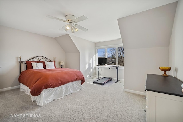 bedroom featuring baseboards, carpet floors, lofted ceiling, and ceiling fan