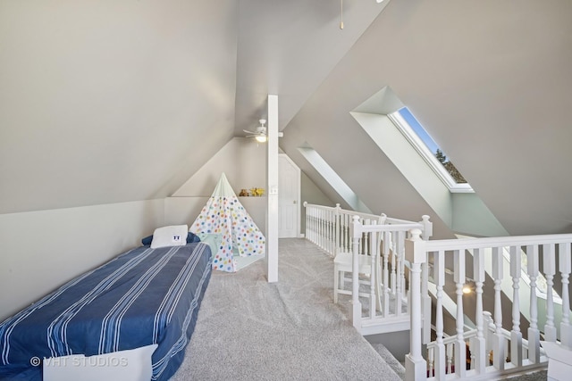 carpeted bedroom with lofted ceiling with skylight