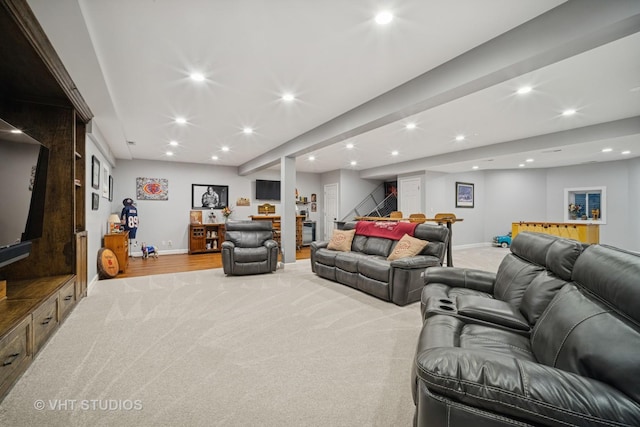 living area featuring stairway, recessed lighting, baseboards, and light carpet