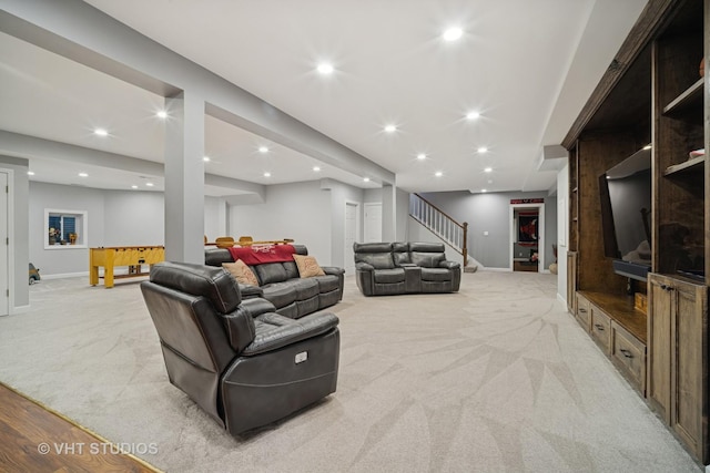 living room with recessed lighting, stairway, light colored carpet, and baseboards