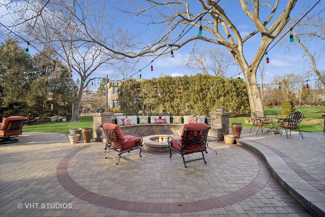 view of patio with a fire pit