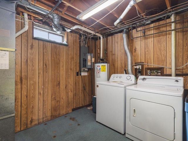 washroom featuring laundry area, independent washer and dryer, and wooden walls