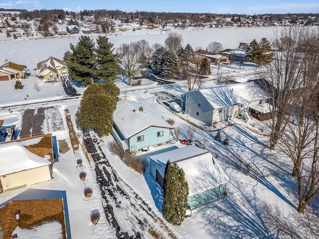 snowy aerial view featuring a residential view