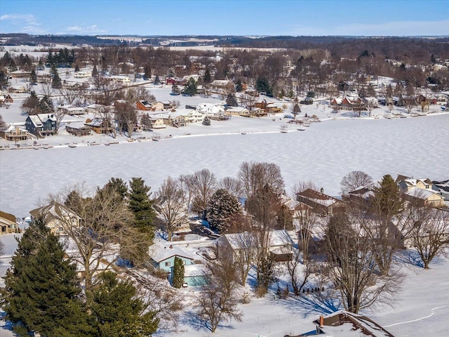 snowy aerial view featuring a residential view