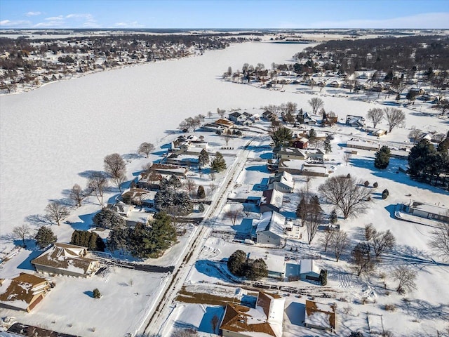 snowy aerial view featuring a residential view