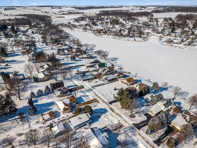 snowy aerial view with a residential view