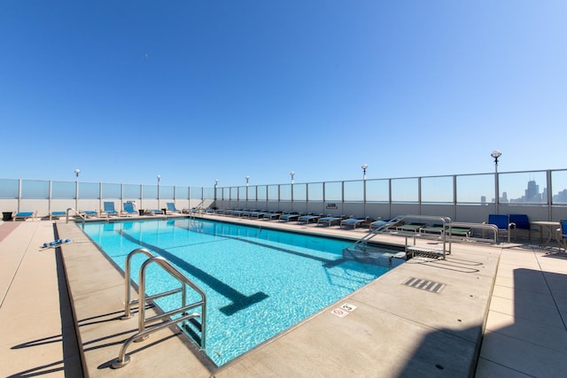 view of pool featuring a patio