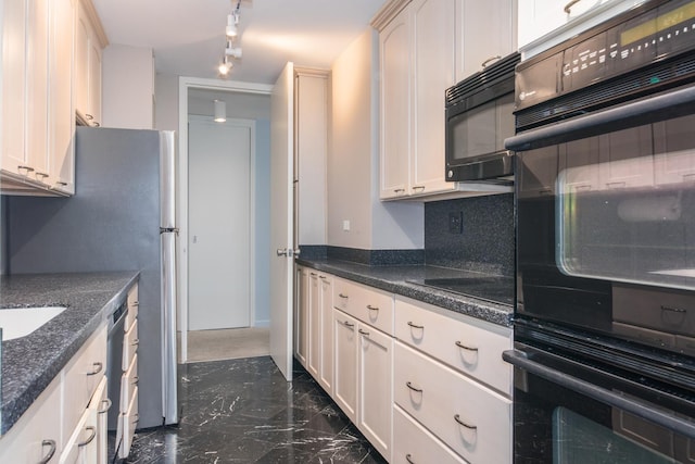 kitchen with track lighting, white cabinets, backsplash, and black appliances