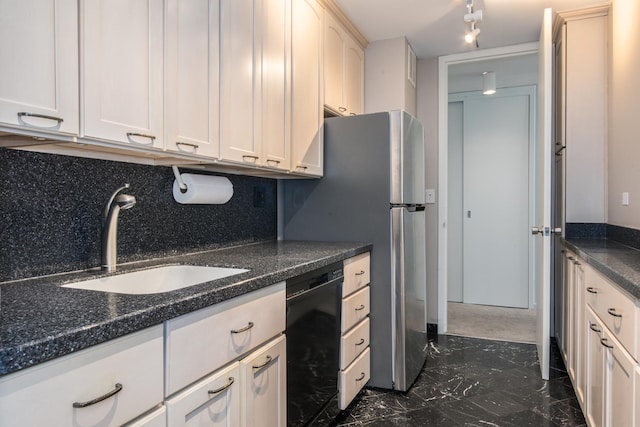 kitchen featuring tasteful backsplash, sink, dark stone counters, and dishwasher