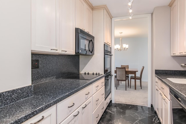 kitchen with sink, backsplash, black appliances, decorative light fixtures, and a chandelier