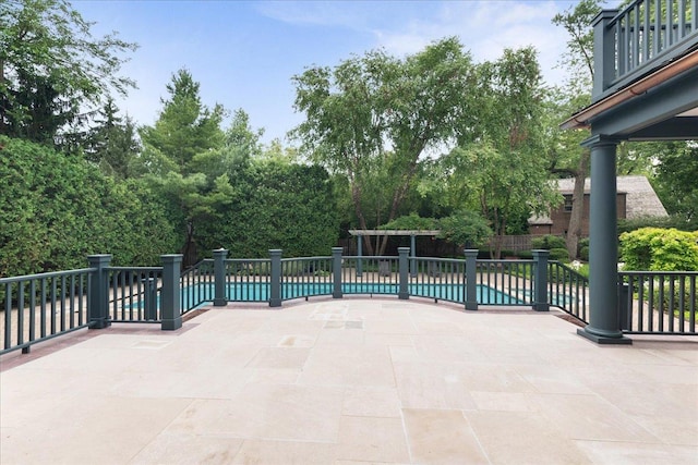 view of patio / terrace featuring a fenced in pool