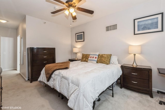 bedroom with light colored carpet and ceiling fan