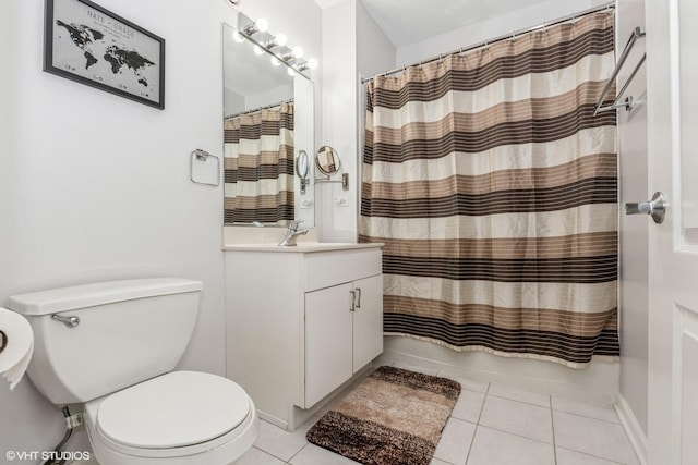 bathroom with tile patterned flooring, vanity, and toilet