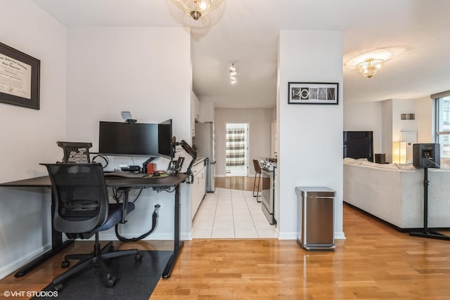 office space with light hardwood / wood-style flooring