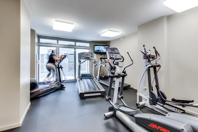 gym with floor to ceiling windows