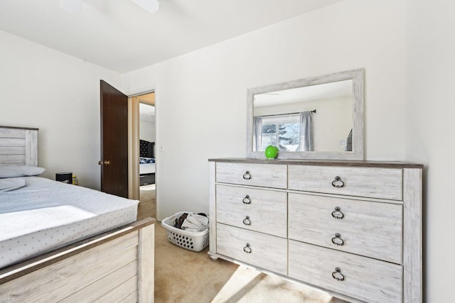 bedroom featuring ceiling fan and light colored carpet