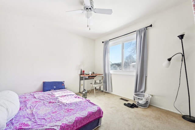 bedroom with visible vents, carpet, and a ceiling fan