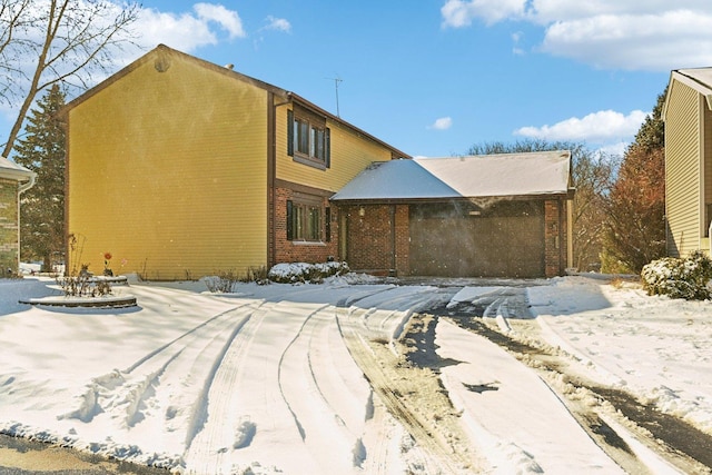 view of front facade featuring brick siding