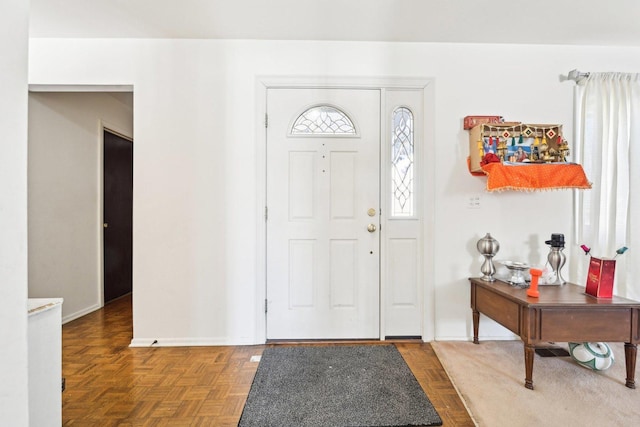 foyer entrance featuring baseboards