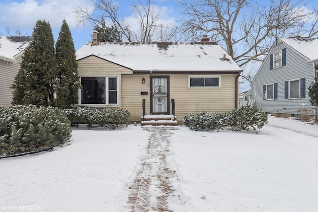 view of front of home featuring a chimney