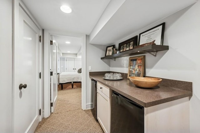 bar with fridge, black dishwasher, and white cabinets