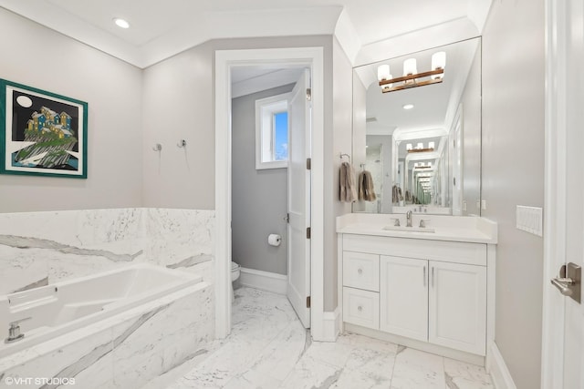 bathroom featuring tiled tub, vanity, ornamental molding, and toilet