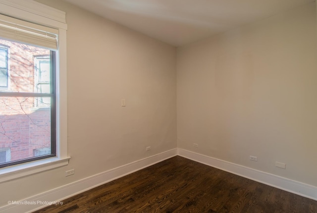 empty room featuring dark hardwood / wood-style floors