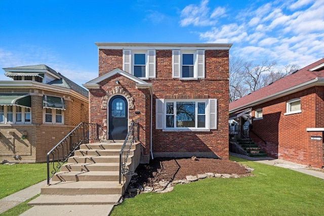 traditional home featuring brick siding and a front yard