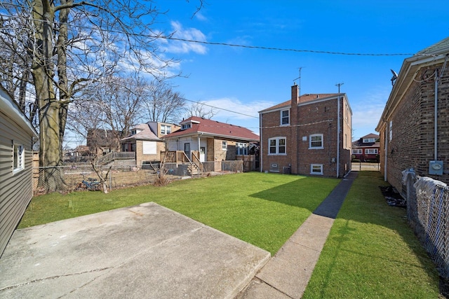 view of yard with a patio and a fenced backyard