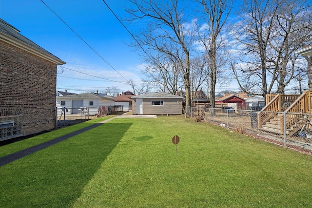 view of yard with an outbuilding and a fenced backyard