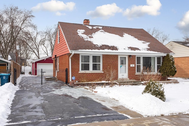 view of front of house featuring an outbuilding and a garage