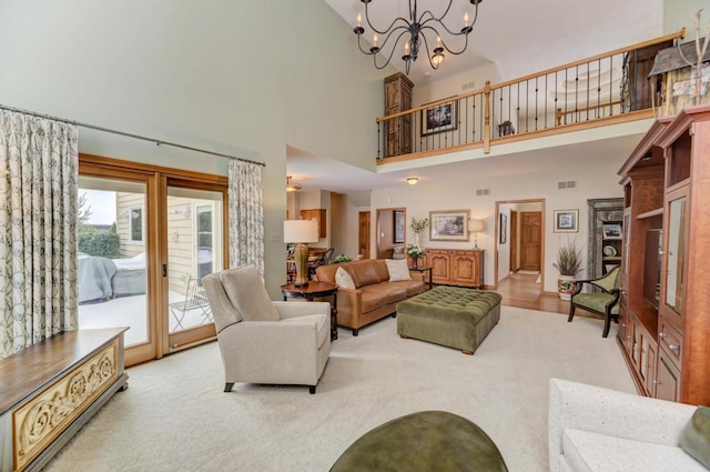 carpeted living room featuring a notable chandelier