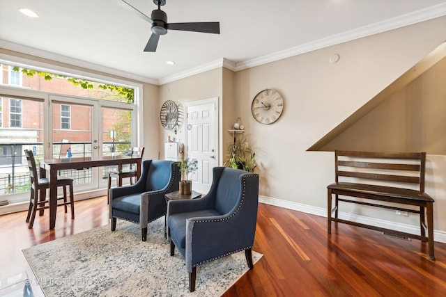 sitting room featuring crown molding, dark hardwood / wood-style floors, and ceiling fan