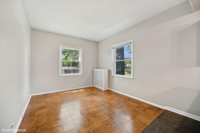 empty room featuring baseboards