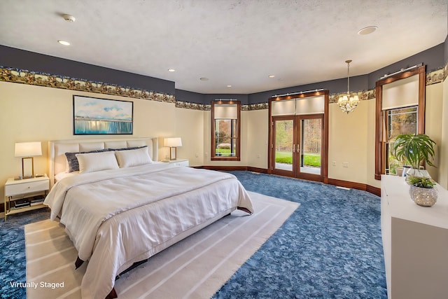 bedroom featuring a notable chandelier, baseboards, access to outside, french doors, and dark colored carpet