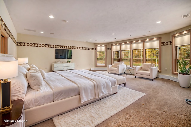 bedroom with baseboards, visible vents, carpet flooring, and recessed lighting