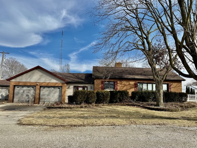 ranch-style house featuring a garage