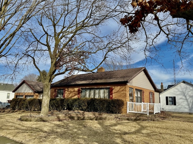 view of side of property featuring a yard