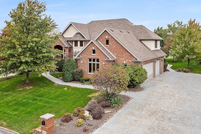 view of front facade with a garage and a front lawn