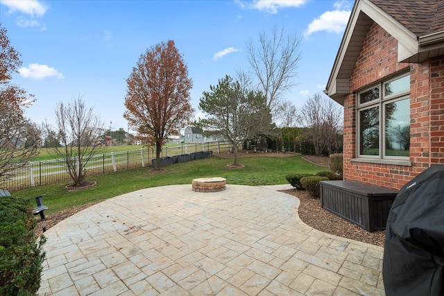 view of patio featuring area for grilling and a fire pit