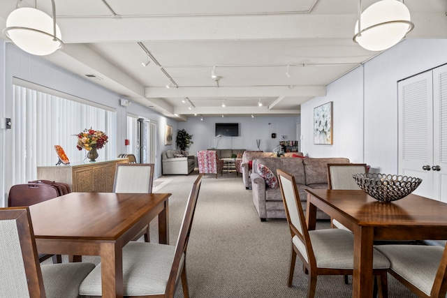 dining space with light colored carpet, visible vents, and track lighting