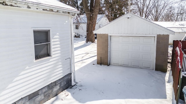 view of snow covered garage